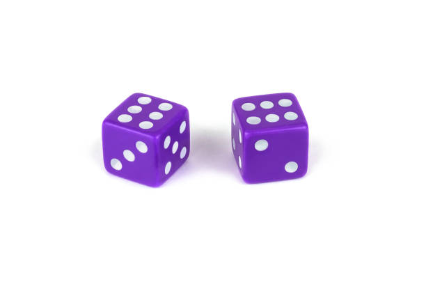 istock Two purple dice isolated on white background, clipping path with shadow 1268381466