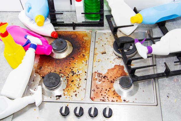 istock dirty kitchen stove, empty and full bottles of detergents around. 1268391589