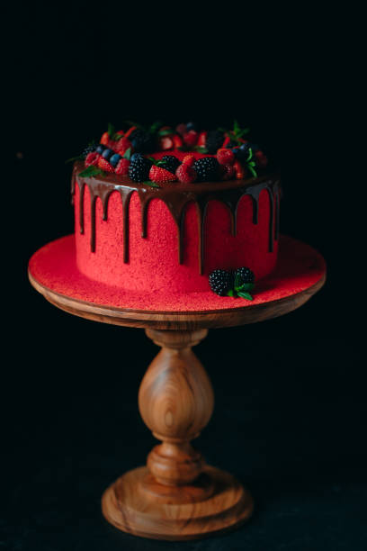 istock Red velvet summer fruit cake on the black background. 1268392587
