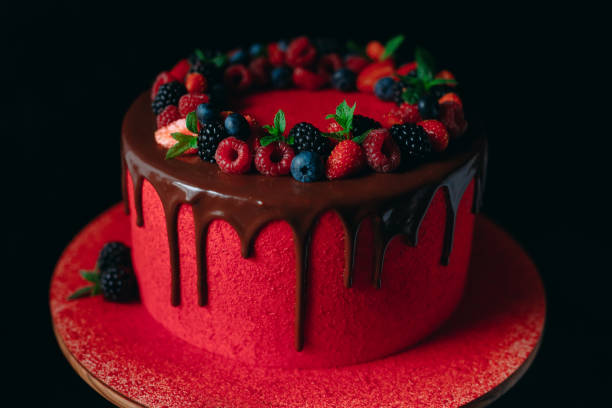 istock Red velvet summer fruit cake on the black background. 1268392593