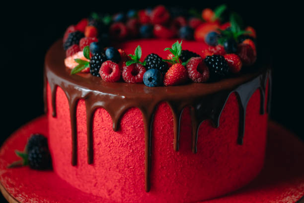 istock Red velvet summer fruit cake on the black background. 1268392598