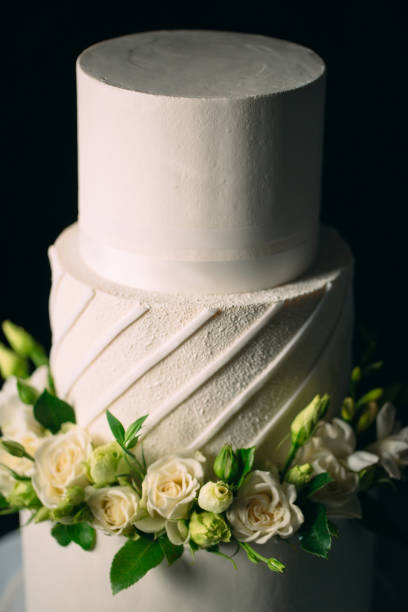 istock Cake is decorated with flowers on a dark background. 1268393464