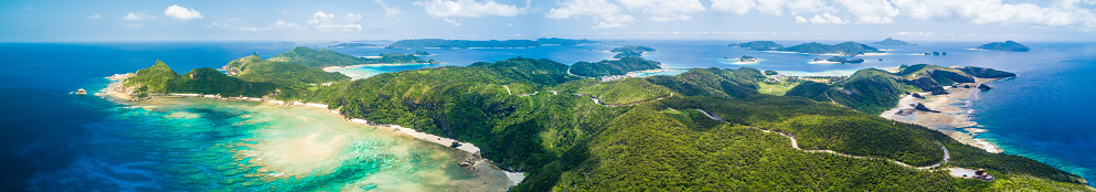 Super wide panorama taken from the air via drone over stunning tropical islands of Okinawa, Japan
