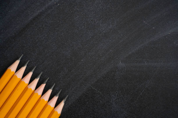 istock Pens on the background of blackboard. Back to school 1268394592