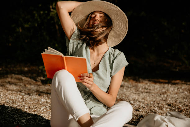 istock Attractive Caucasian brunette in a summer dress, holding a hat, fall concept 1268395252