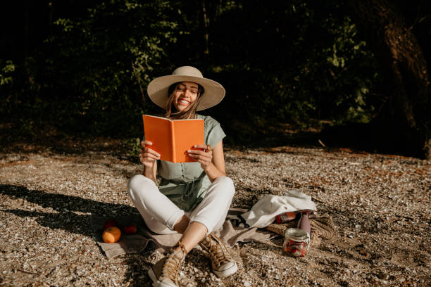 istock Reading book, humble and happy in nature 1268395410