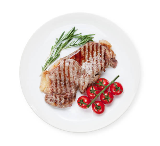 istock Sirloin steak with rosemary and cherry tomatoes 1268397694