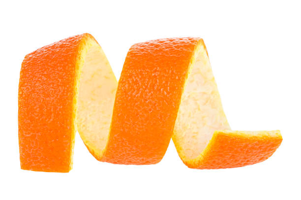 istock Orange zest isolated on a white background. Curly orange peel. Citron. 1268398421