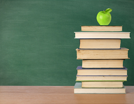 Blackboard with copy space and books