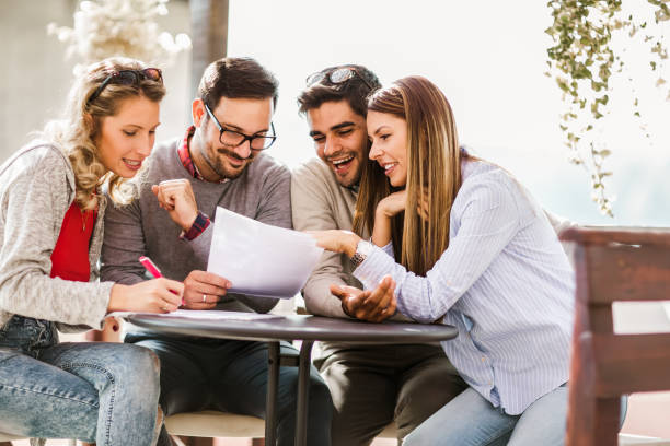 istock Group of four friends having fun a coffee together. 1268400886