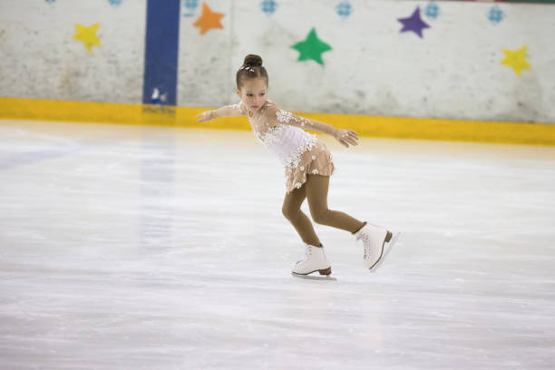 Competitions in figure skating among children.A child in figure skating competitions Competitions in figure skating among children.A child in figure skating competitions figure skating stock pictures, royalty-free photos & images