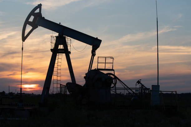 istock Oil Pump on orange sunset. 1268402750