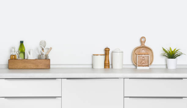 istock Contemporary utensils and spices standing on kitchen countertop with space 1268404686