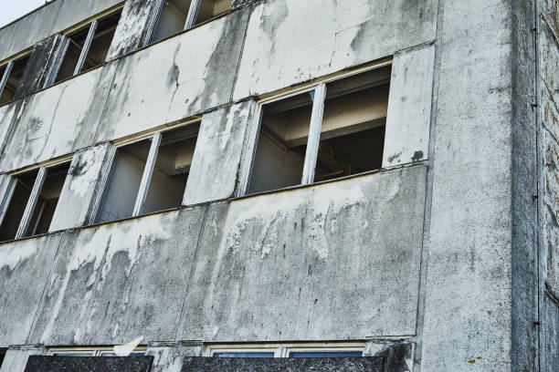 istock Demolished old neglected building with open windows 1268405824