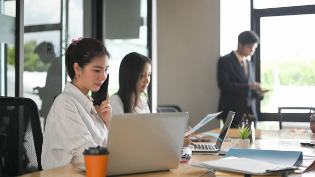 istock A comfortable business workspace is surrounding by a happy employee and various office stuff. 1268406256