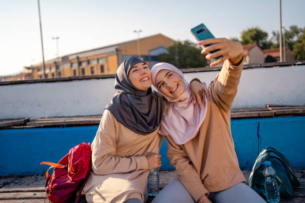 istock Muslim women taking selfie after workout 1268411303