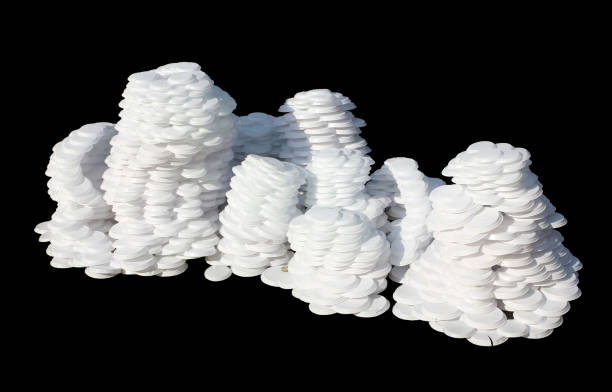 istock Thousands of wet used disposable plastic plates heap - isoalted 1268413131