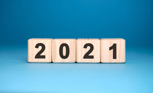 istock 2021 years on wooden cubes on a gradient blue background 1268413160