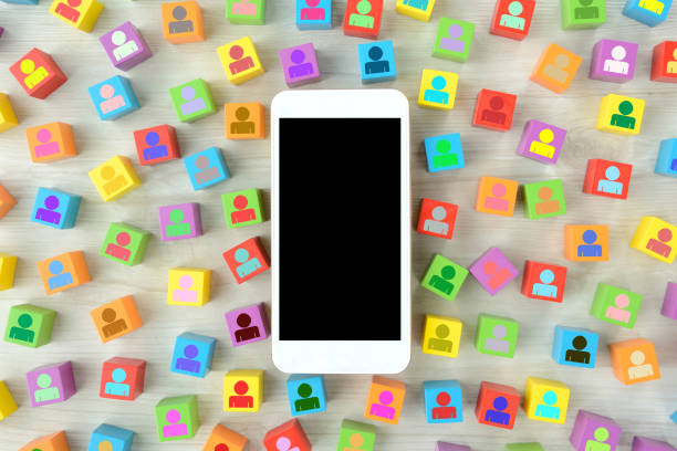 istock Smart phone and colorful blocks with human pictogram 1268414809