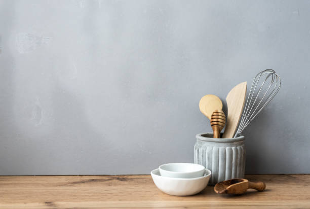 istock Kitchenware on a wooden table against a gray background 1268415669