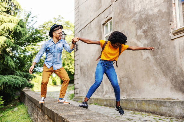 istock Young attractive multiracial couple having fun outdoors. 1268416335