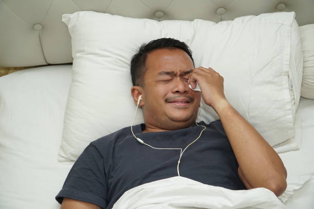 istock Listening Sad Song When Sleeping 1268417693