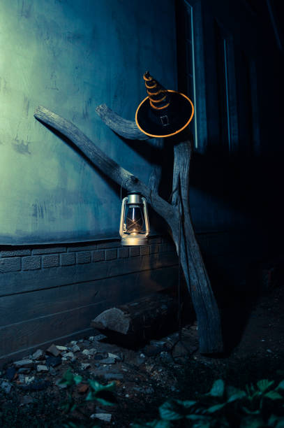 istock Cone hat, lantern, stick and snag at night for Halloween. 1268417957