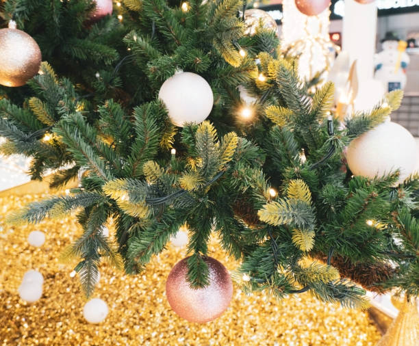 istock evergreen Christmas tree decorated with golden balls and glitters 1268418093