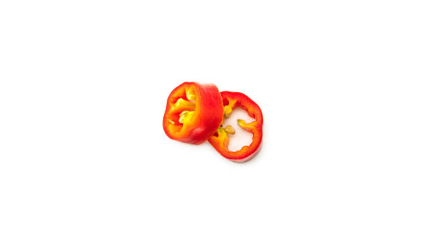 istock Red hot chili pepper slices on a white background 1268420925
