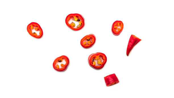istock Red hot chili pepper slices on a white background 1268421994