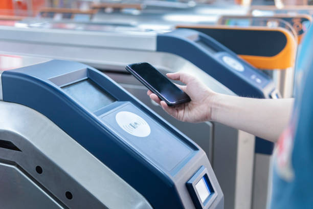 istock An Asian man checking out at metro station using mobile phone with mobile payment 1268429269