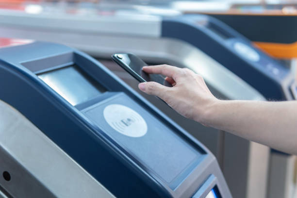 istock An Asian man checking out at metro station using mobile phone with mobile payment 1268429270