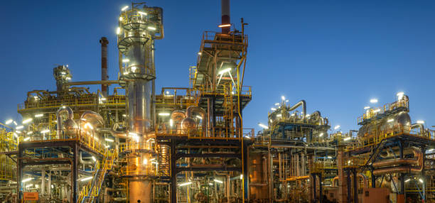 istock Installations of a modern refinery at night - panoramic view 1268430983