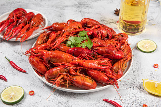 istock Boiled cooked red crawfish and beer on a plate 1268432374