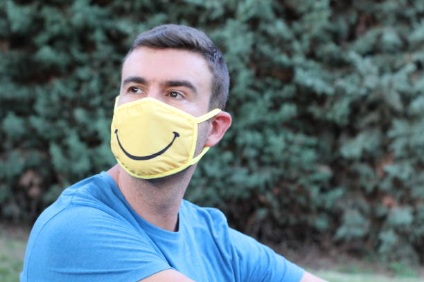COVID-19, a senior adult man with a homemade face mask for Social Distancing. Outdoor portrait.