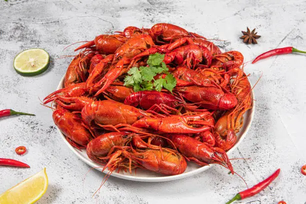 Photo of Boiled cooked red crawfish on a plate