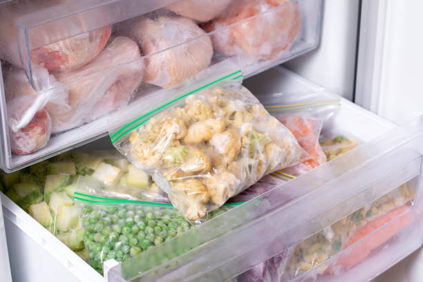 istock Frozen cauliflower in plastic bag in a freezer 1268433791