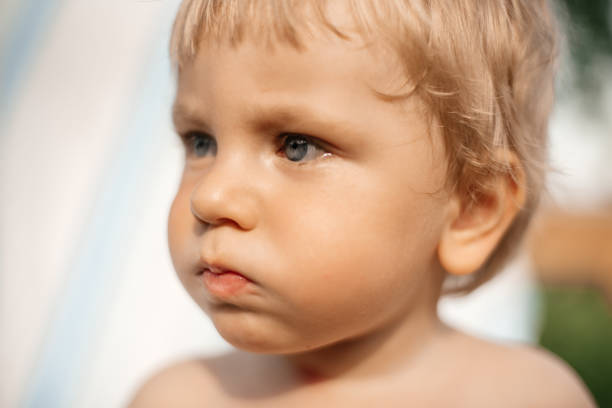 istock The baby is blond with bright blue eyes. 1268434107