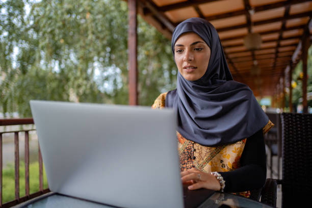 istock Muslim businesswoman working from cafe 1268435176