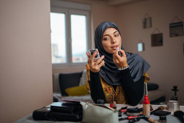 istock Beautiful Muslim woman applying make up 1268435208