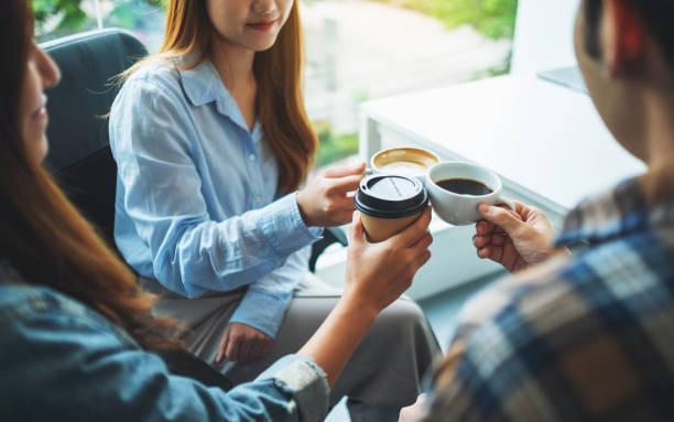 istock A group of young people enjoyed drinking and clinking coffee cups 1268435270