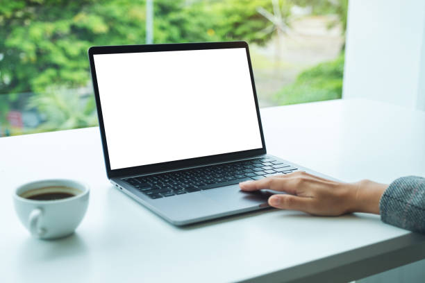 istock a hand using and touching on laptop touchpad with blank white desktop screen in office 1268435271