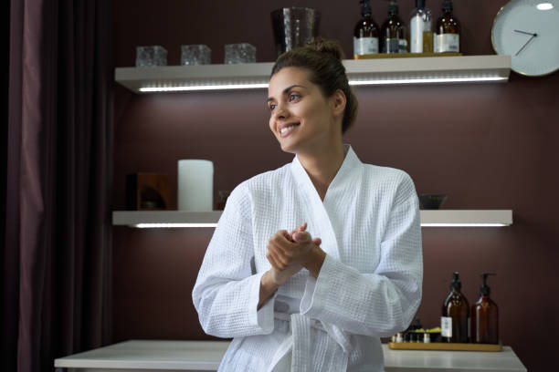 istock Happy lady looking away in spa clinic 1268438665