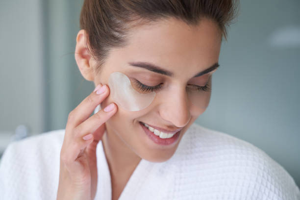 istock Pleased young lady with under eye patch on the face 1268438725