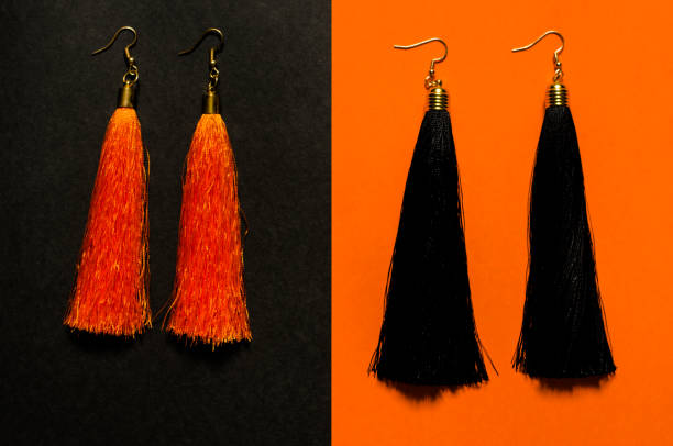 istock Orange and black tassel earrings. 1268438955