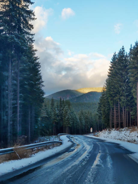 istock view of road at winter mountains 1268440044