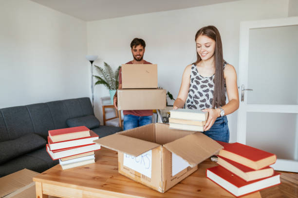 istock Students preparing books, taking books out of the boxes 1268441693