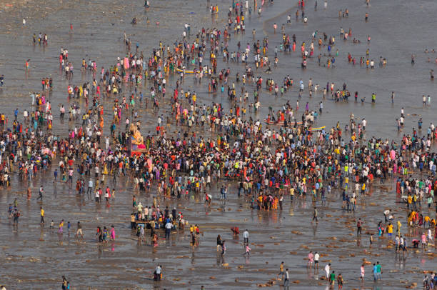 This Image was shot on September 27, 2015 at Girgaon Chowpatty, Mumbai, Maharashtra. Devotees bid adieu to Lord Ganesha during Ganesh Visarjan which marks the end of the ten day long Ganesh Chaturthi festival.