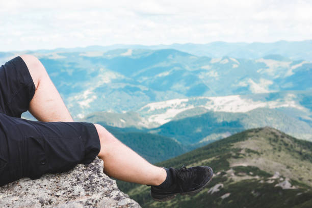 istock legs on the top of the peak 1268443453
