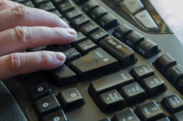 istock Right male hand on a black computer keyboard. 1268445320